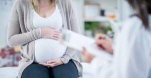 Pregnant woman during doctor consultation for High Risk Pregnancy Treatment in Pune and pregnancy monitoring